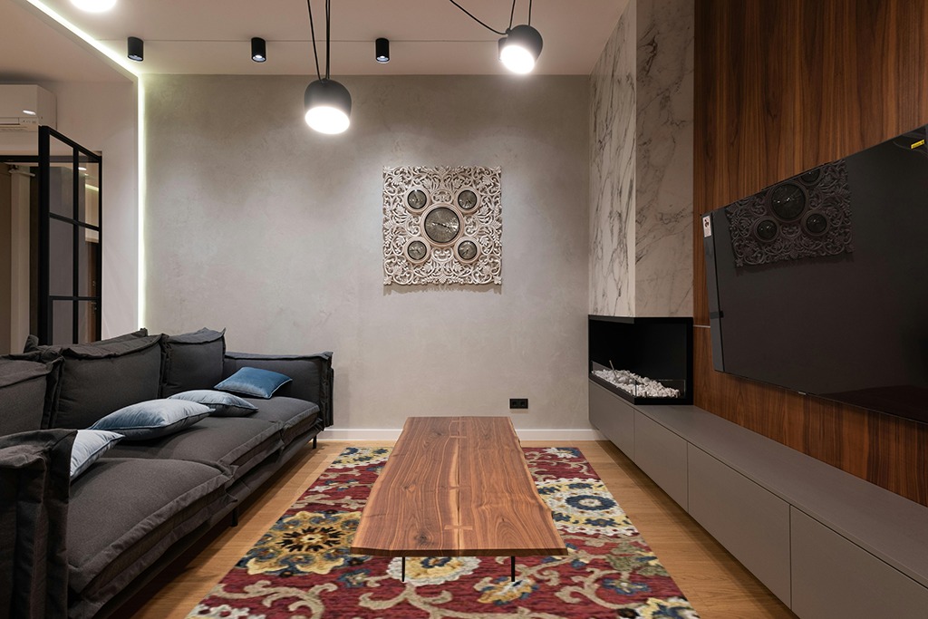 SAFAVIEH Blossom Collection 6' x 9' Red / Multi BLM401C Handmade Premium Wool Area Rug in Dark Wood Living Room with Black Couch