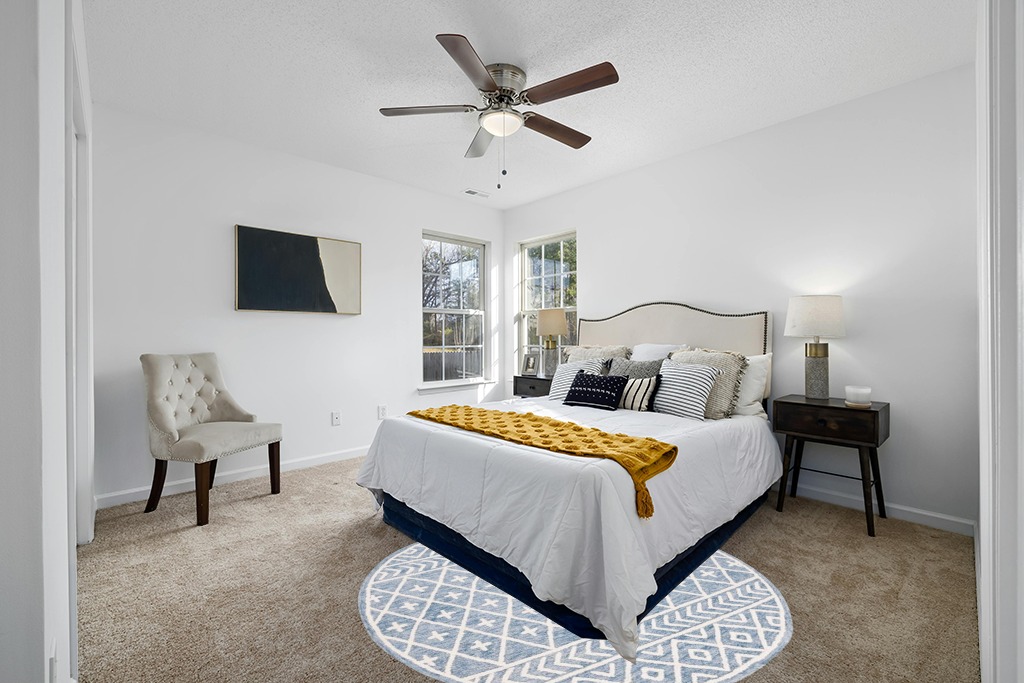 Rug on carpet bedroom ideas in White and Yellow Modern Bedroom