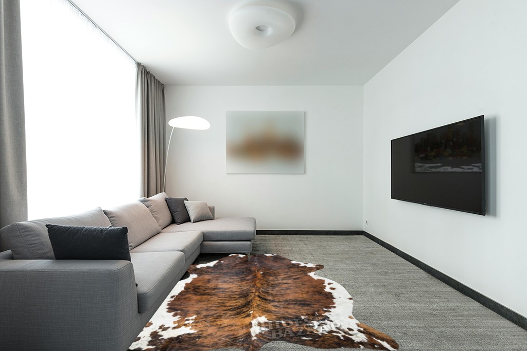 Cowhide rug decor ideas in Modern Living Room with Grey Couch