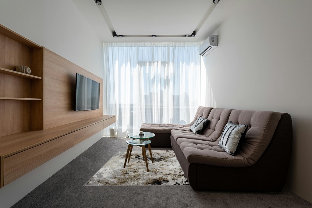 Rugs on grey carpet ideas in Grey Living Room with Brown Couch