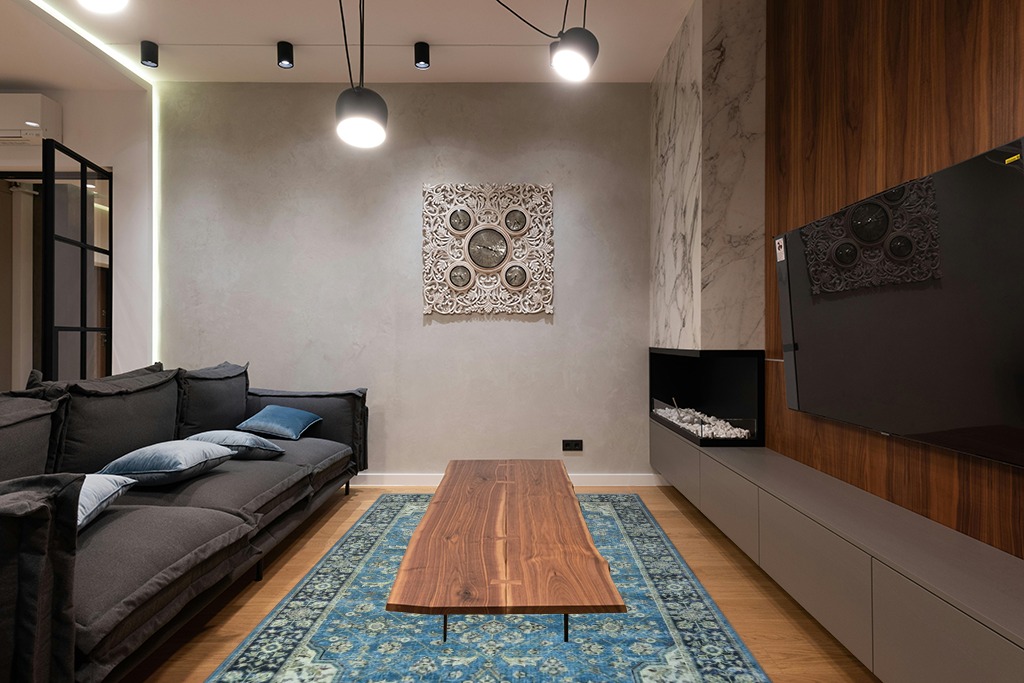 Grey room rug ideas in Dark Wood Living Room with Black Couch