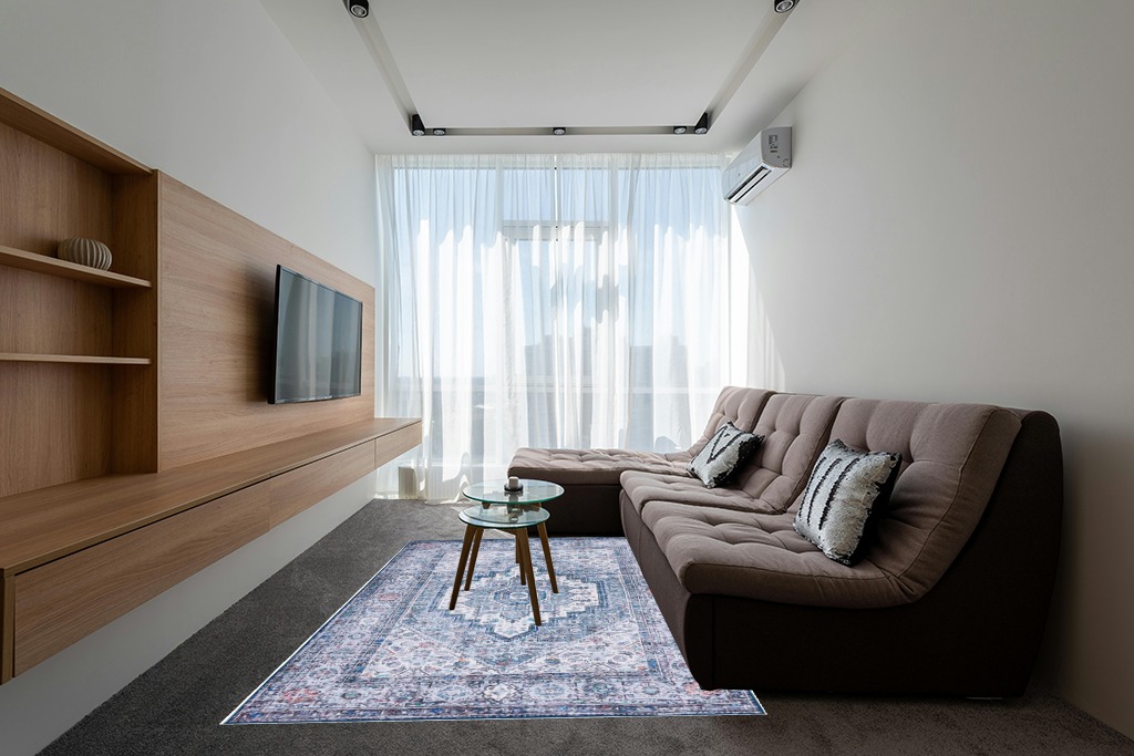 Rugs on grey carpet ideas in Grey Living Room with Brown Couch
