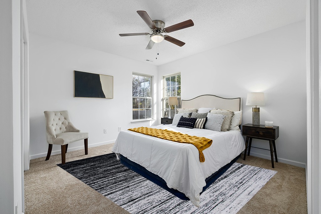 Rug on carpet bedroom ideas in White and Yellow Modern Bedroom