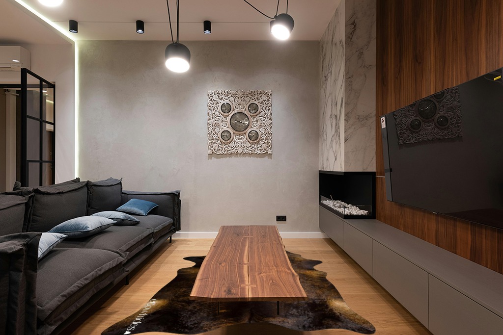 Cowhide rug living room ideas in Dark Wood Living Room with Black Couch