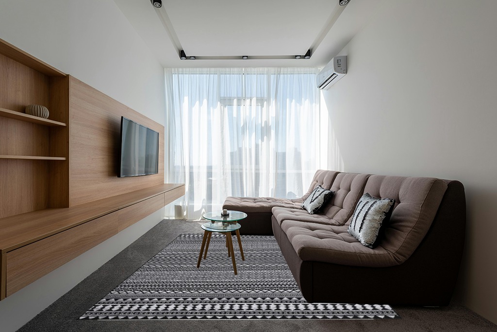 Rugs on grey carpet ideas in Grey Living Room with Brown Couch