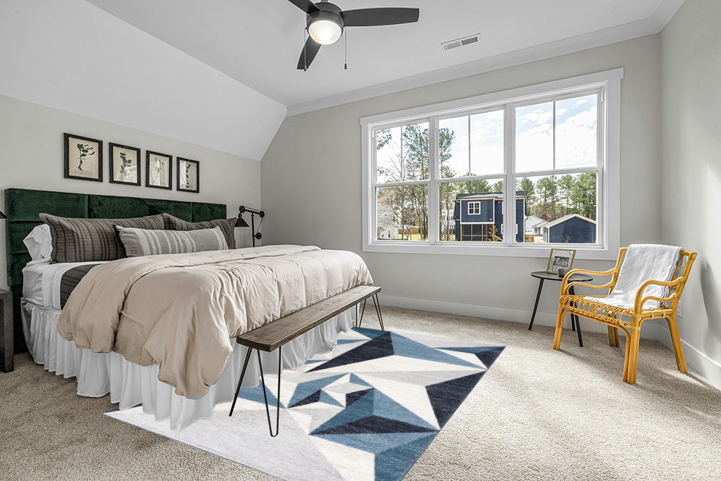Rug on carpet bedroom ideas in Grey Traditional Bedroom with King Bed