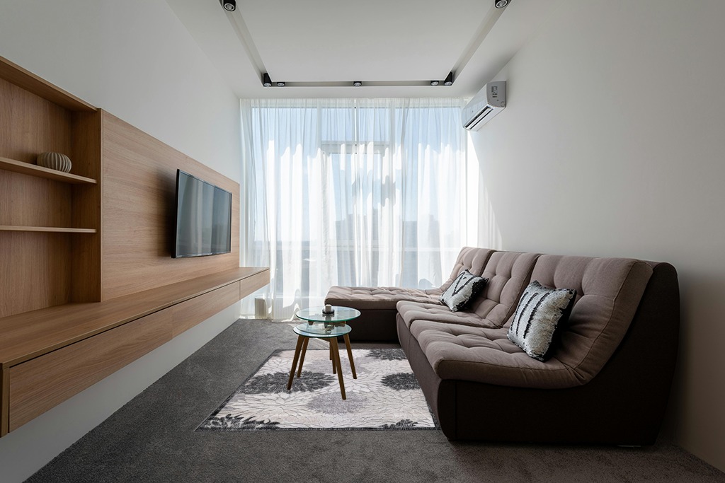 Rugs on grey carpet ideas in Grey Living Room with Brown Couch