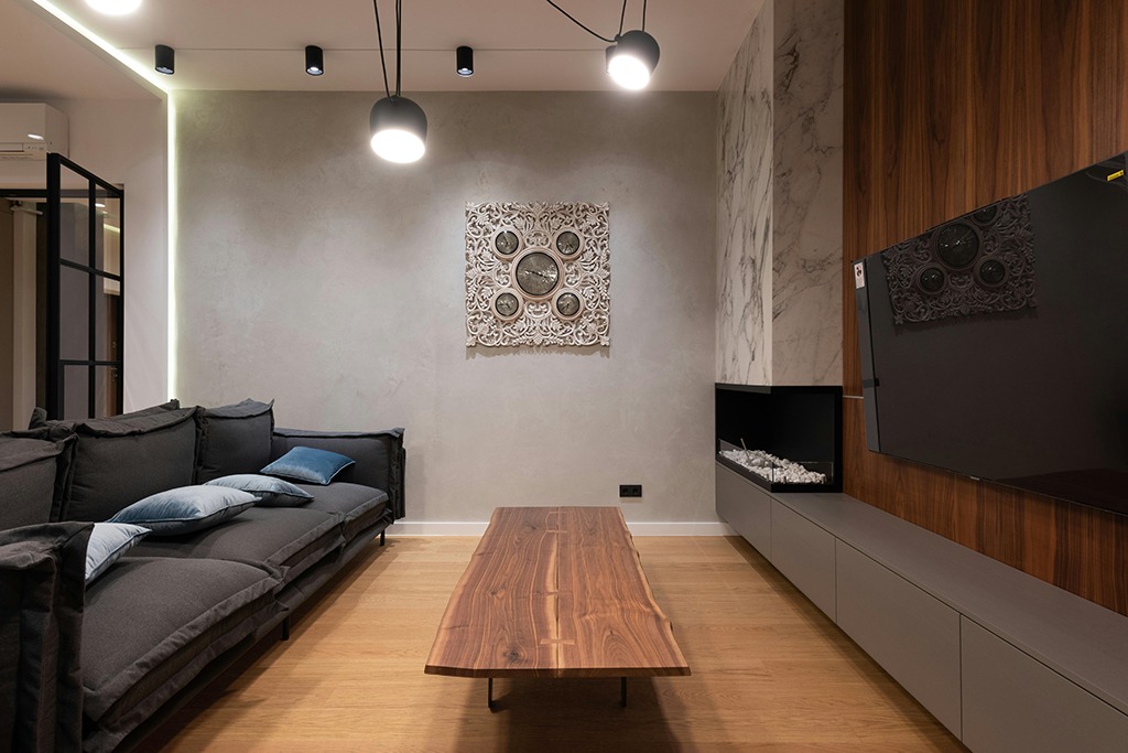 Large rug ideas in Dark Wood Living Room with Black Couch