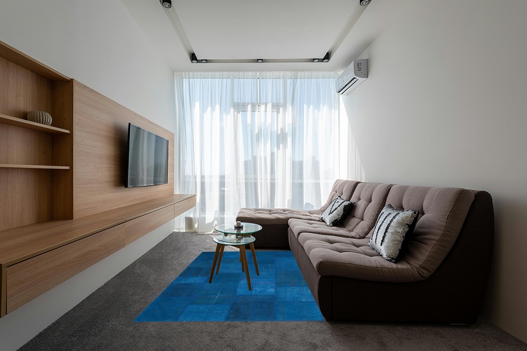 Blue rug ideas in Grey Living Room with Brown Couch